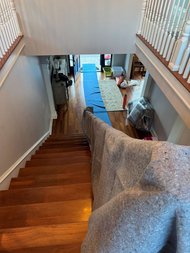Moving blankets protecting an interior staircase
